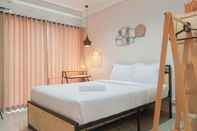 Bedroom Cozy Studio Apartment at Patraland Amarta By Travelio