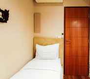 Bedroom 2 Luxury Classic 2BR at Vida View Makassar Apartment By Travelio