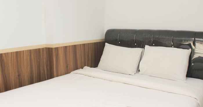 Kamar Tidur Nice and Homey 2BR at Patraland Urbano Apartment By Travelio