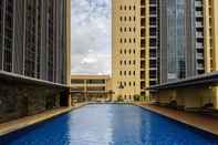 Swimming Pool 1BR Bali Style Luxury Apartment at BRANZ BSD City by Travelio