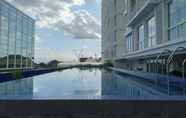 Swimming Pool 5 Simply and Comfort Studio Room at Mataram City Apartment By Travelio