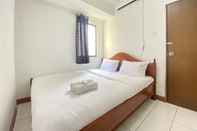 Bedroom Cozy 2BR Apartment at Gateway Ahmad Yani Cicadas By Travelio