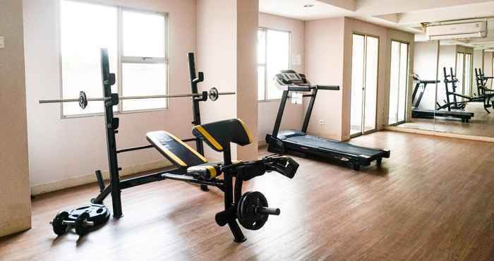 Fitness Center Comfort and Minimalist Studio at Belmont Residence Puri Apartment By Travelio