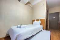 Bedroom Stylish Studio Room Apartment at Harvard Jatinangor By Travelio