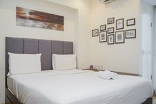卧室 Cozy and Minimalist 1BR at Branz BSD City Apartment By Travelio