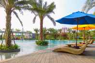 Swimming Pool Elegant and Warm 1BR at Gold Coast Apartment By Travelio