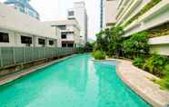 Swimming Pool 5 Elegant Studio Room at Capitol Park Residence Apartment By Travelio