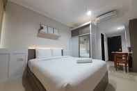 Bedroom Cozy Studio Room Apartment at Patraland Amarta By Travelio
