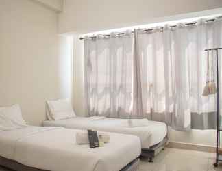 Bedroom 2 Lavish Studio Apartment at Springlake Summarecon By Travelio