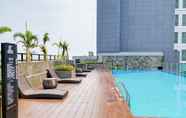 Swimming Pool 6 Comfortable and Elegant 1BR Apartment Bintaro Embarcadero By Travelio