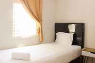 Bedroom Tranquil and Warm 2BR at Springlake Summarecon Bekasi Apartment By Travelio