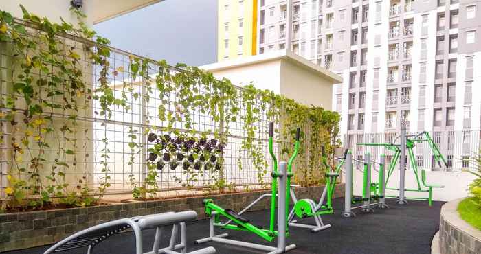 Fitness Center Tranquil and Warm 2BR at Springlake Summarecon Bekasi Apartment By Travelio