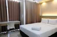 Kamar Tidur Compact and Best Choice Studio at Apartment Taman Melati Surabaya By Travelio