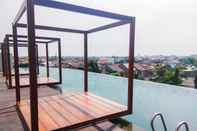 Swimming Pool Warm and Cozy Studio at Grand Kamala Lagoon Apartment By Travelio