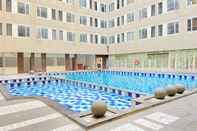 Swimming Pool Cozy Studio at Emerald Towers Apartment Bandung By Travelio