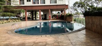 Swimming Pool 5 Tidy and Comfort Studio Apartment Serpong Greenview By Travelio