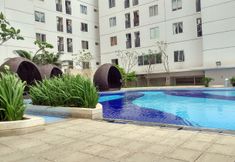 Swimming Pool 4 Best Location and Comfy Studio Room at Bassura City Apartment By Travelio