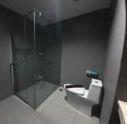 Toilet Kamar 3 Spacious and Elegant 1BR at Patraland Amarta Apartment By Travelio