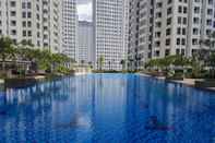 Swimming Pool Fully Furnished and Cozy 1BR at M-Town Signature Apartment By Travelio