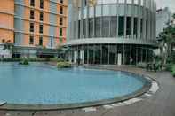 Kolam Renang Homey and Fully Furnished 1BR Apartment at Pejaten Park Residence By Travelio