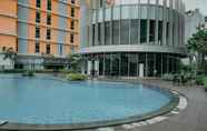 Swimming Pool 6 Homey and Fully Furnished 1BR Apartment at Pejaten Park Residence By Travelio