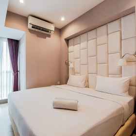 Bedroom 1 Comfy and Stunning 1BR at Branz BSD Apartment By Travelio, BSD Hotels