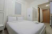 Kamar Tidur Cozy and White Studio at Vida View Makassar Apartment By Travelio