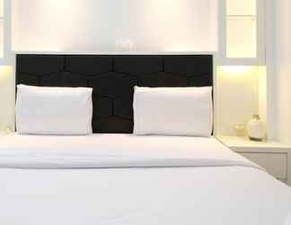 Bedroom 2 Homey and Spacey 2BR at Supermall Mansion Apartment By Travelio