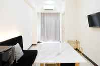 Lobi Homey and Spacey 2BR at Supermall Mansion Apartment By Travelio