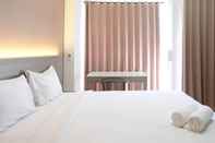 Bedroom Cozy Stay and Good Deals Studio at Taman Melati Surabaya Apartment By Travelio