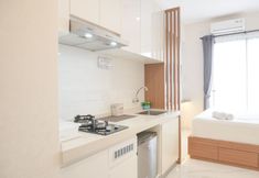 Lobby 3 Warm and Comfy Studio Room at Sky House BSD Apartment By Travelio