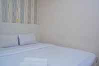 Bedroom Warm and Minimalist 2BR at Bassura City Apartment By Travelio