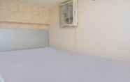 Bilik Tidur 3 Warm and Minimalist 2BR at Bassura City Apartment By Travelio