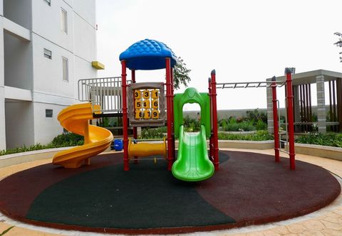 Exterior Warm and Minimalist 2BR at Bassura City Apartment By Travelio