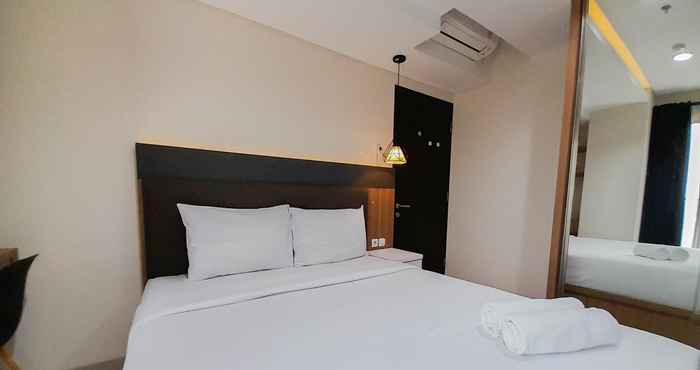 Bedroom Nice and Fancy 1BR at Patraland Amarta Apartment By Travelio