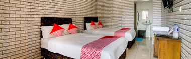 Kamar Tidur 3 SPOT ON 91227 Al Bayt Syariah Guest House 