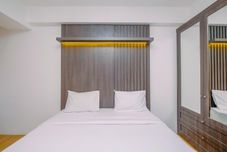 Bedroom Tidy and Restful Studio at Gunung Putri Square Apartment By Travelio