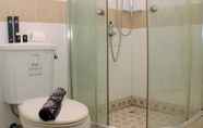 In-room Bathroom 4 Cozy and Warm Studio at Metropark Condominium Jababeka Apartment By Travelio