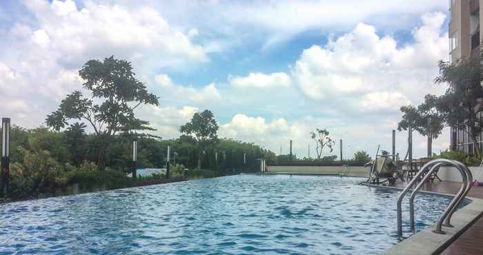 Swimming Pool Comfort and Cozy Living 1BR at Oasis Cikarang Apartment By Travelio