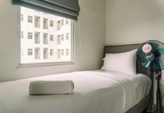 Bedroom 2 Minimalist 2BR at Apartment Serpong Garden near Train Station By Travelio