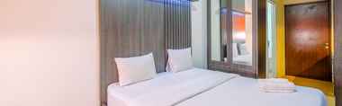 Bedroom 2 Homey and Minimalist Studio at Gunung Putri Square Apartment By Travelio