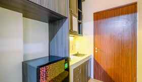 Common Space 5 Comfort and Warm Living Studio Room at Gunung Putri Square Apartment By Travelio