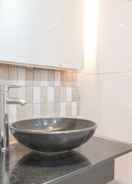 BATHROOM Cozy and Minimalist Studio at Ambassade Kuningan Apartment By Travelio