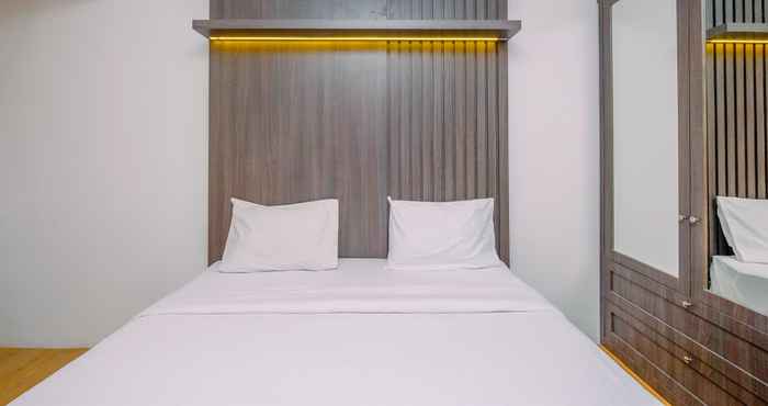 Bedroom Warm and Minimalist Studio at Gunung Putri Square Apartment By Travelio