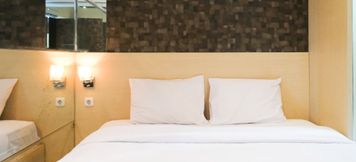 寝室 2 Cozy and Strategic Studio at Tamansari Papilio Apartment By Travelio