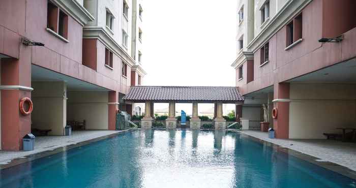 Swimming Pool Comfy and Fully Furnished 2BR Apartment at Gajah Mada Mediterania By Travelio