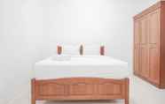 Kamar Tidur 3 Comfy and Fully Furnished 2BR Apartment at Gajah Mada Mediterania By Travelio