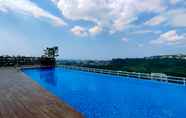 Swimming Pool 5 Nice and Fancy 1BR with Extra Room at Amartha View Apartment By Travelio