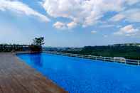 Swimming Pool Nice and Fancy 1BR with Extra Room at Amartha View Apartment By Travelio