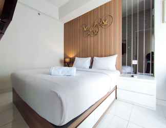 Bedroom 2 Nice and Fancy 1BR with Extra Room at Amartha View Apartment By Travelio